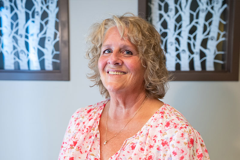 headshot of staff member smiling