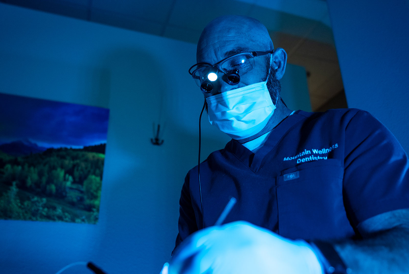 doctor performing oral surgery for dental treatment on patient