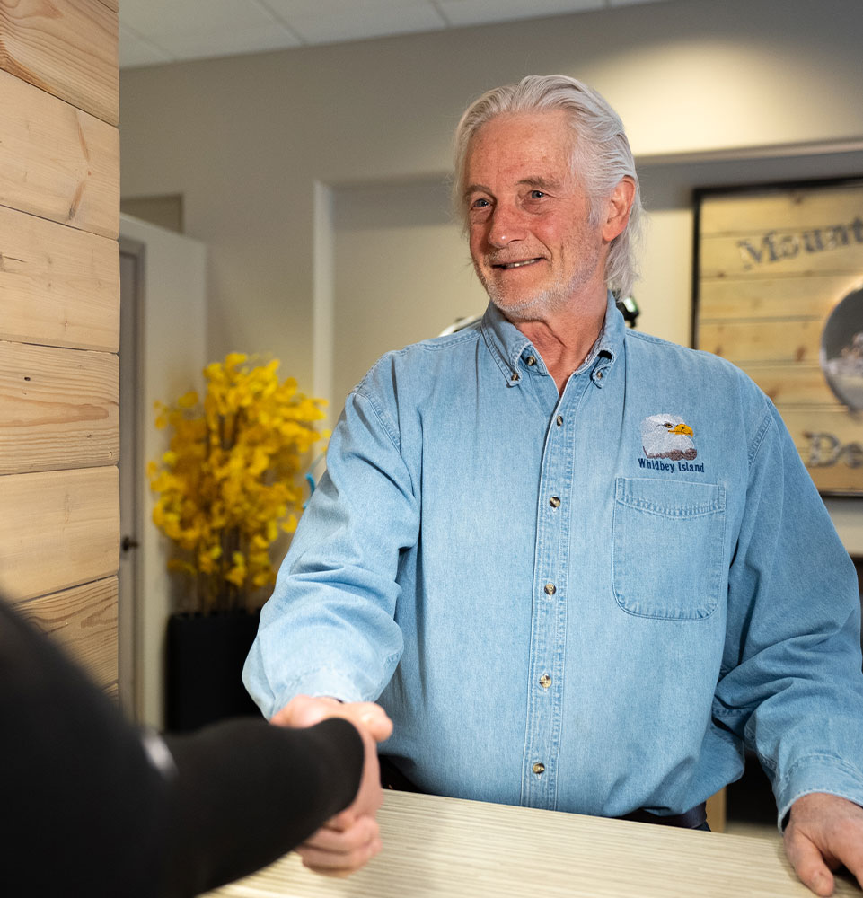 patient being helped at the front desk of the dental center