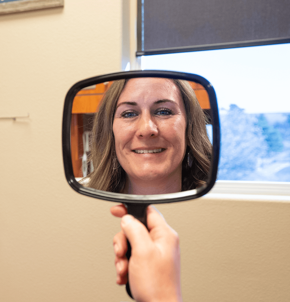 close up of patient smiling brightly after their dental procedure