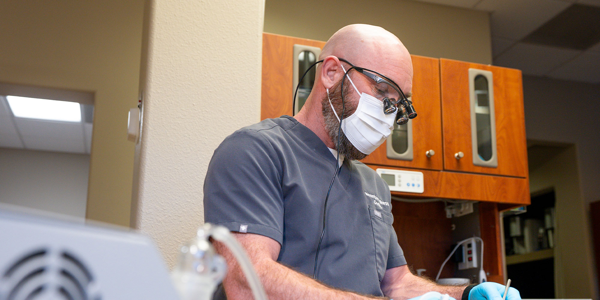 doctor examining dental patient within the dental center