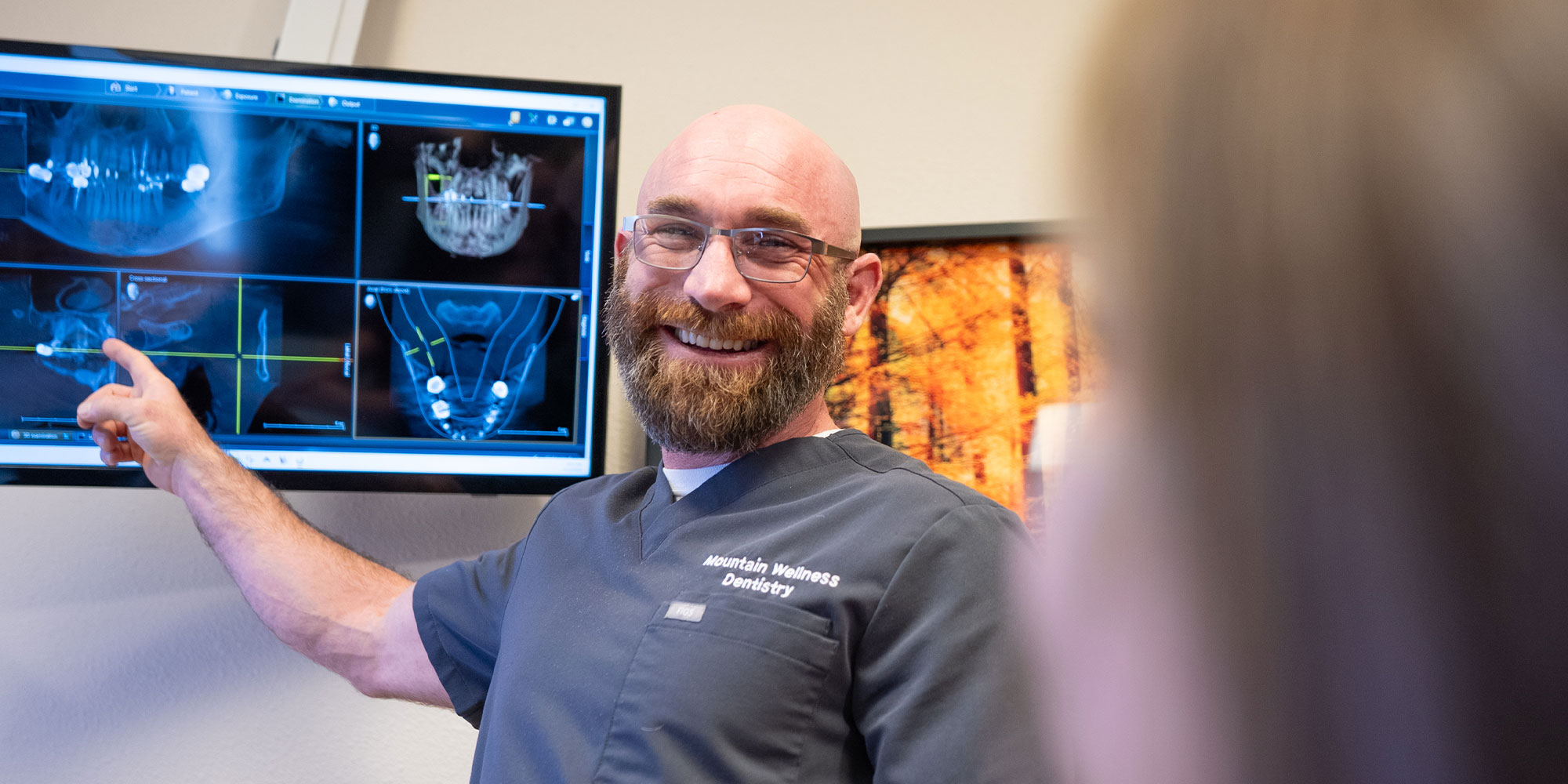 doctor going over dental procedure information