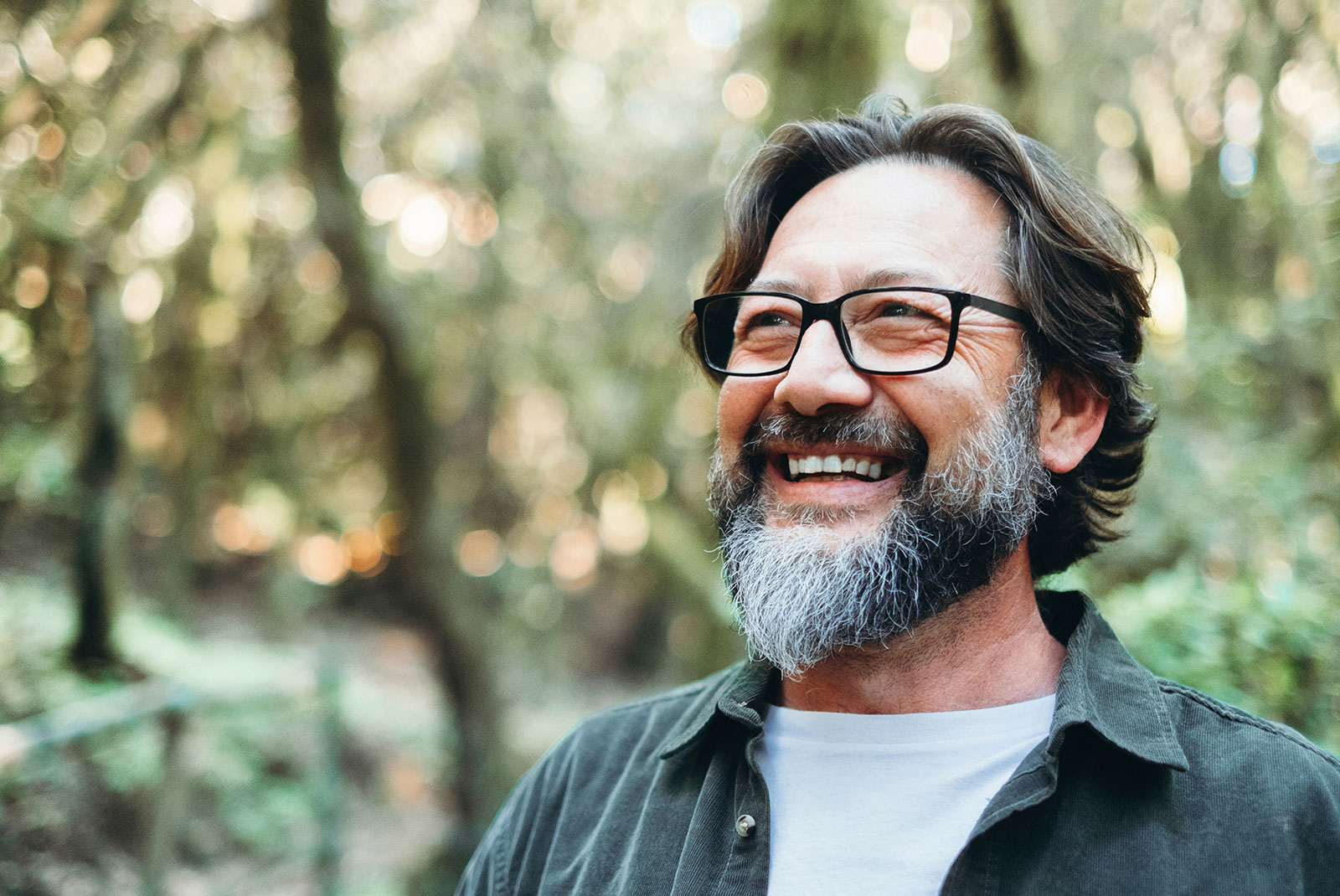 person smiling brightly after their dental procedure