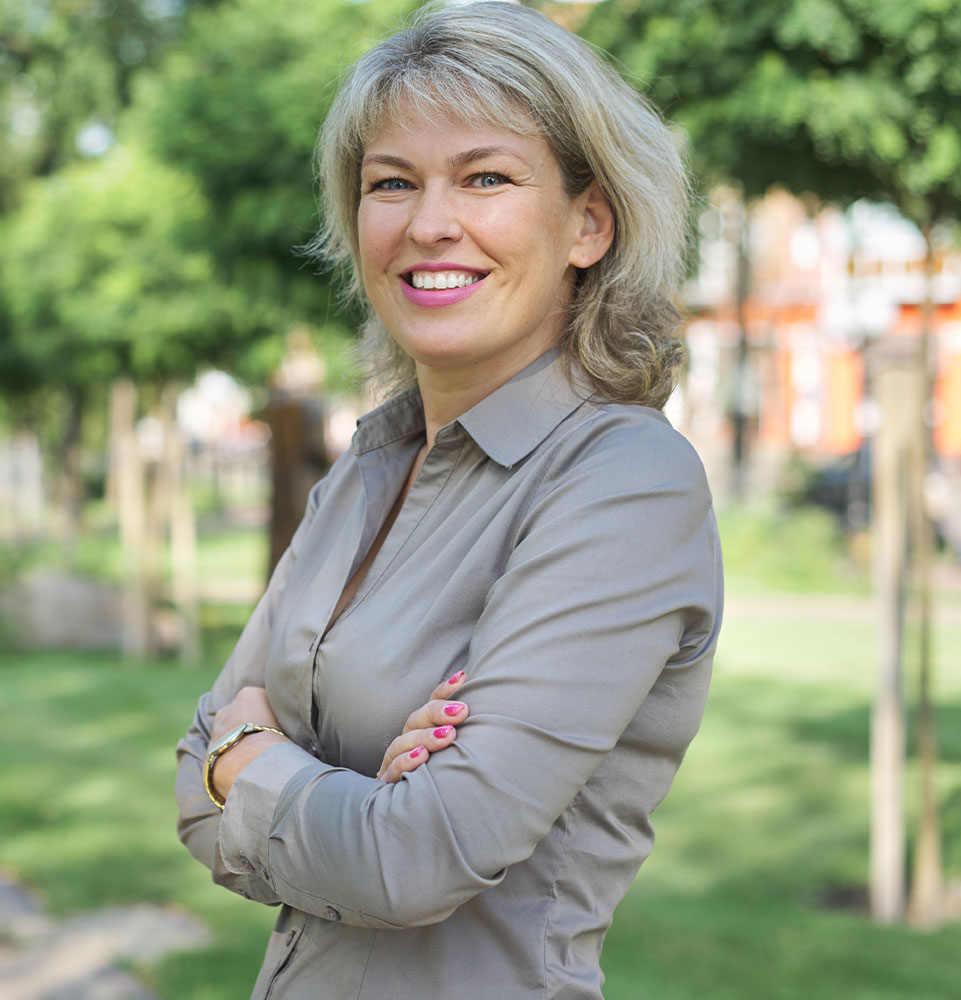 Outdoor portrait of positive mature middle-aged woman
