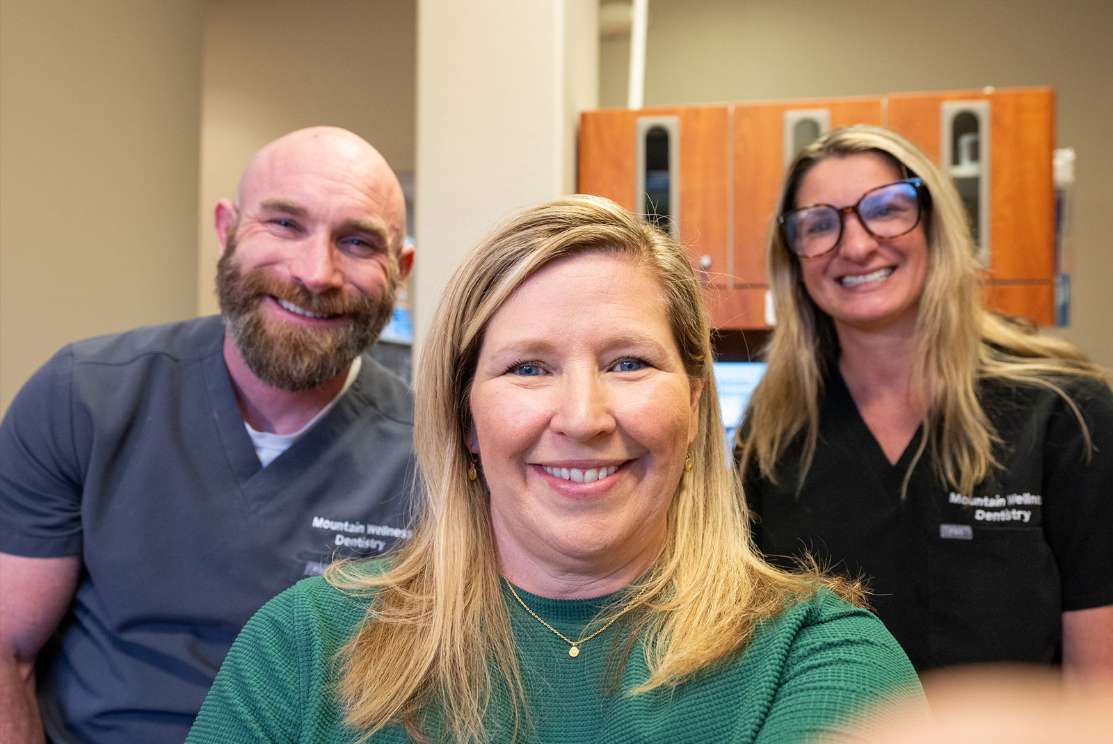 dental patient smiling brightly after their dental procedure