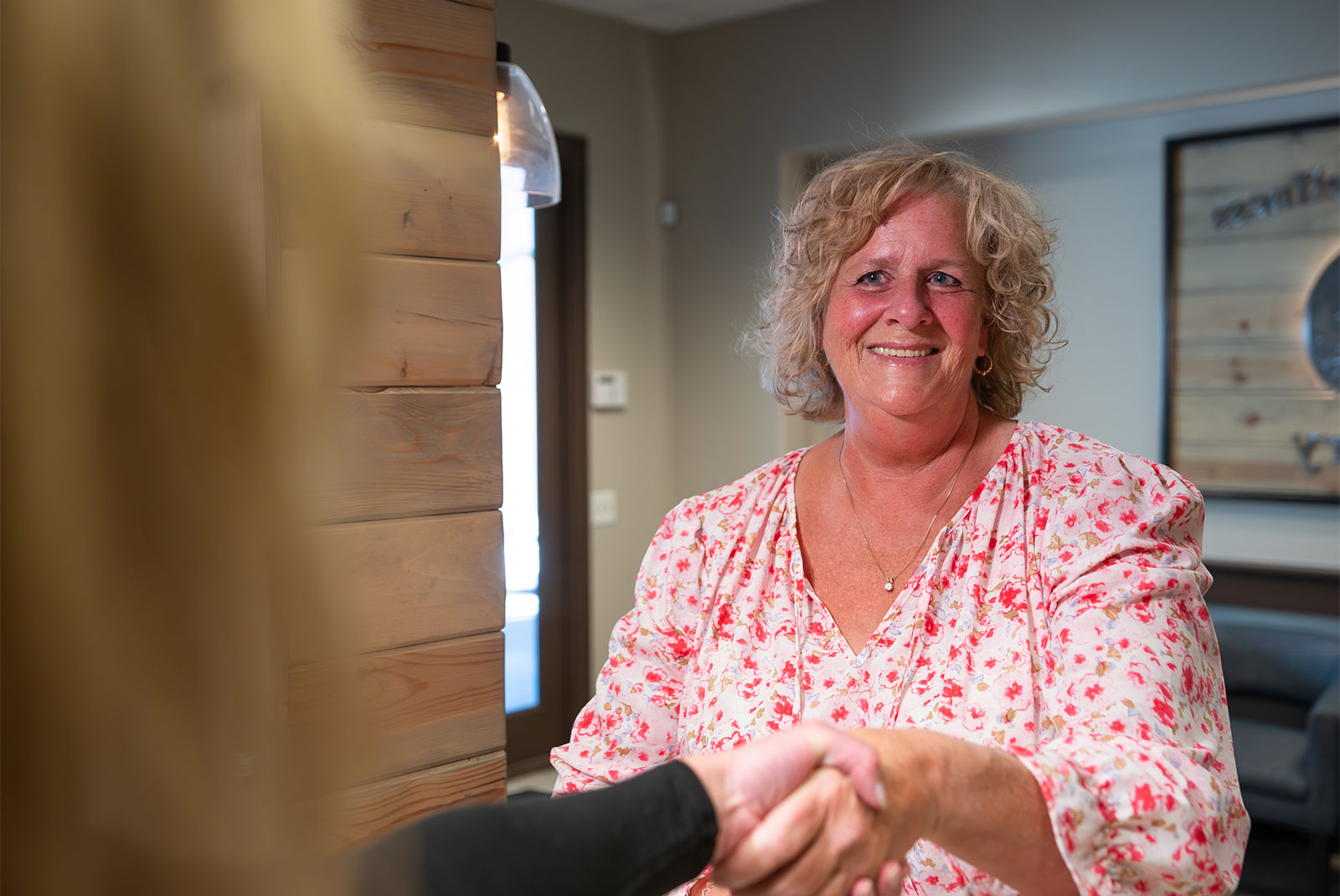 patient being helped at the front desk of the dental center