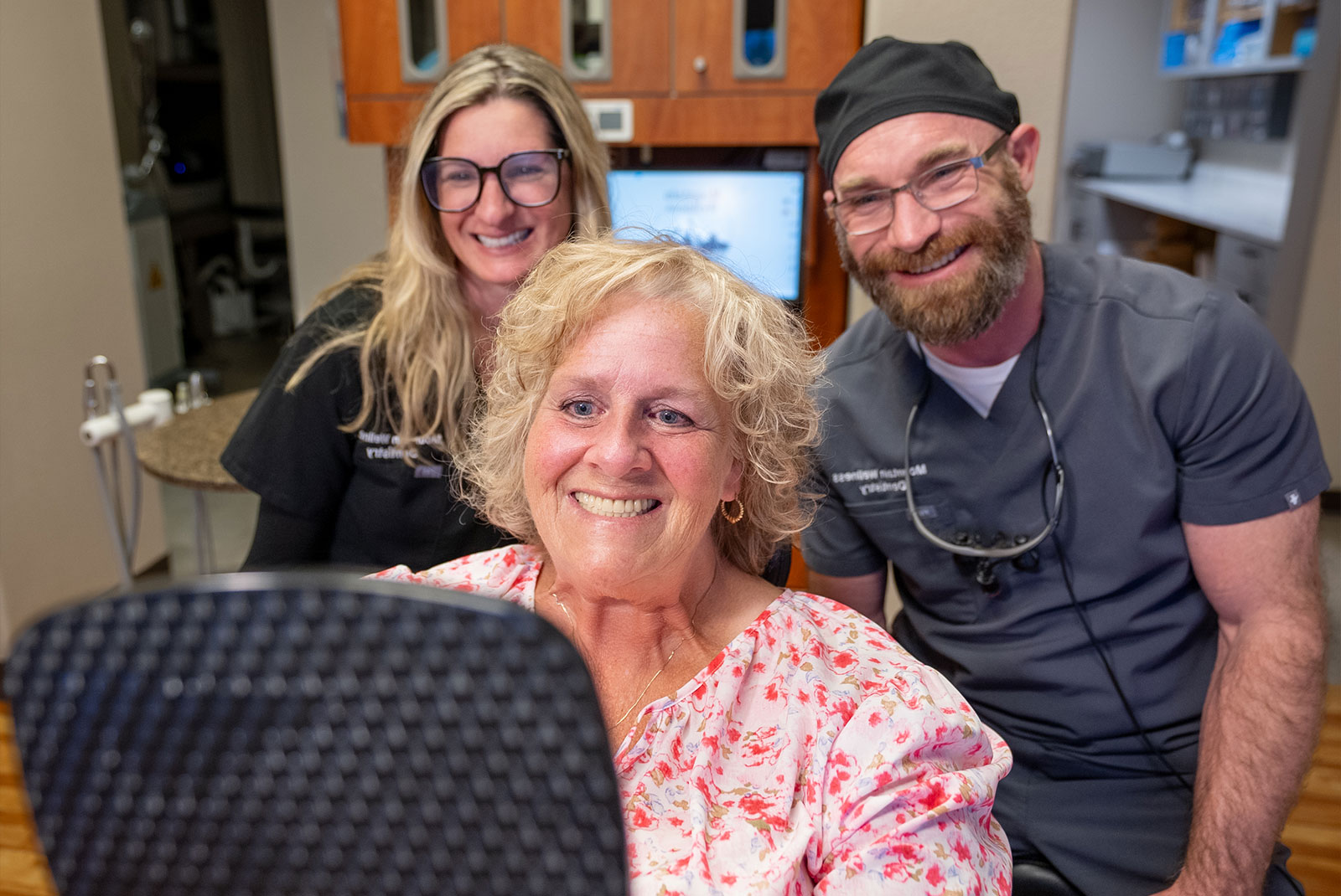 patient and doctor smiling brightly after their dental procedure