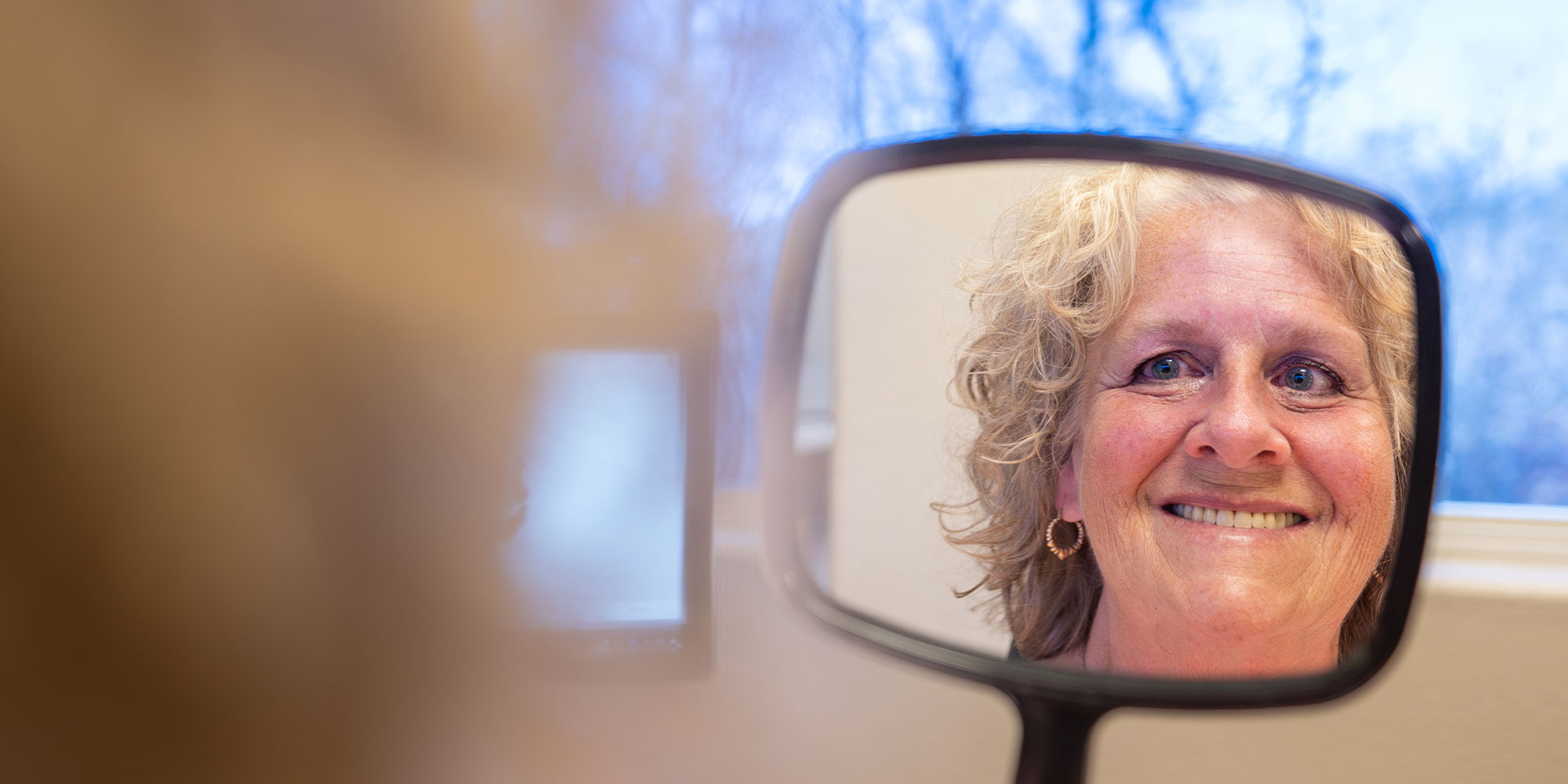 patient smiling brightly after their dental implant procedure