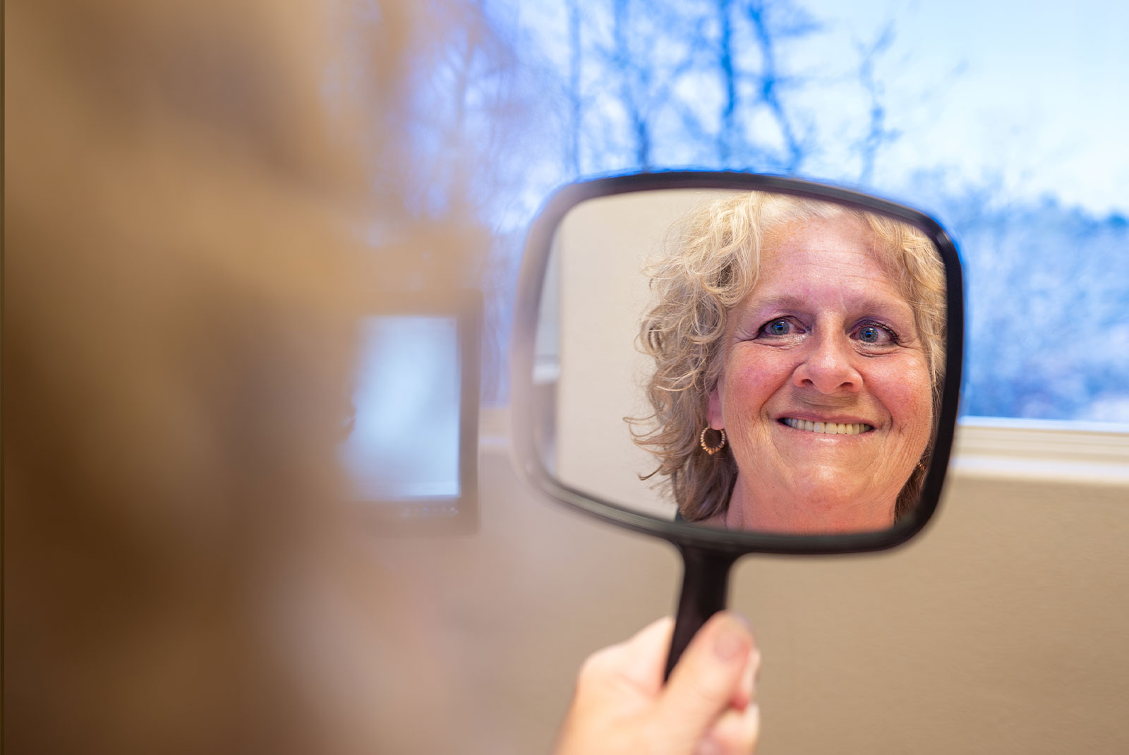 patient smiling brightly after their dental implant procedure