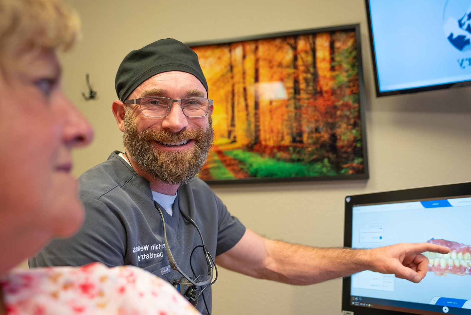 doctor going over dental procedure information with patient