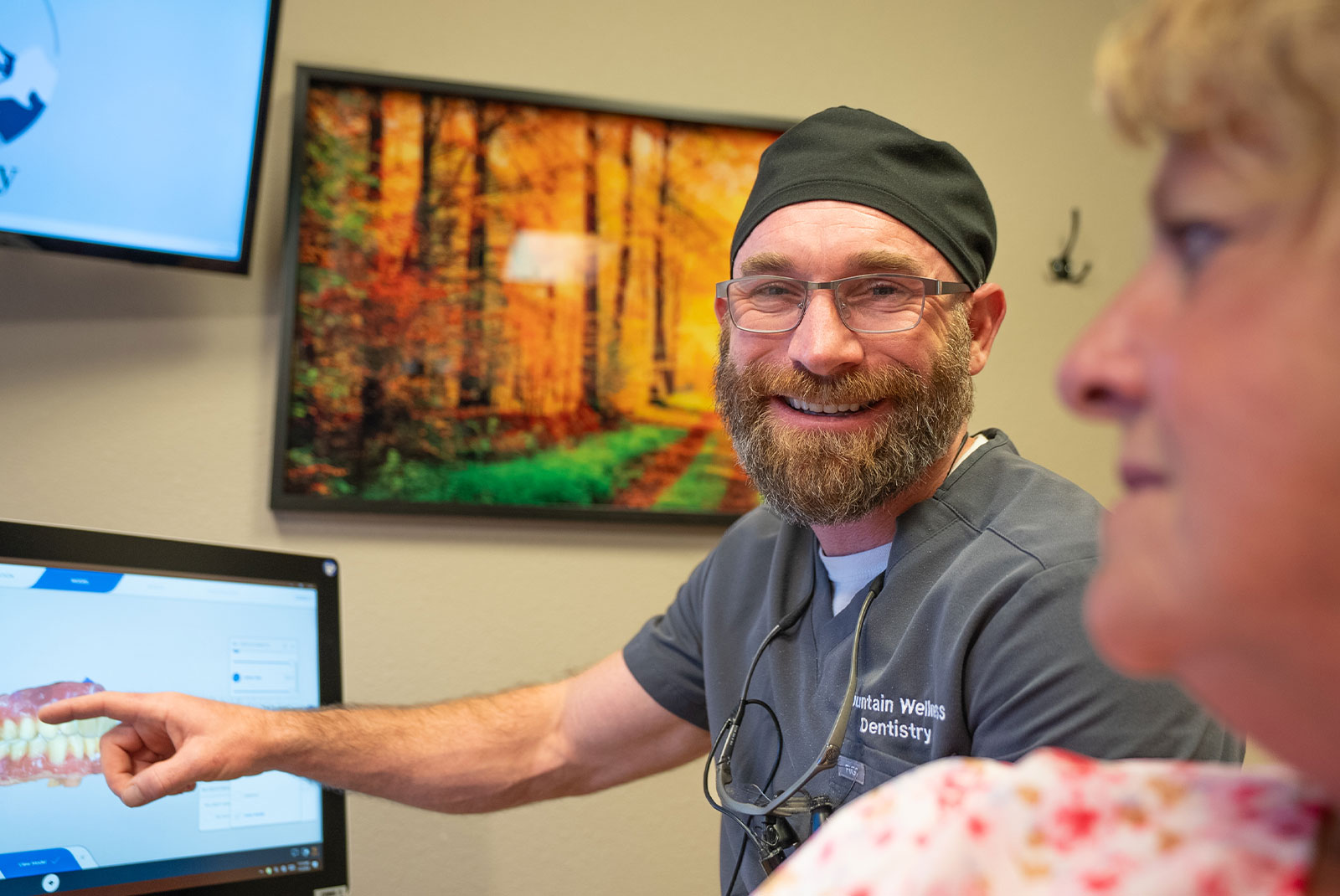 doctor going over dental procedure information