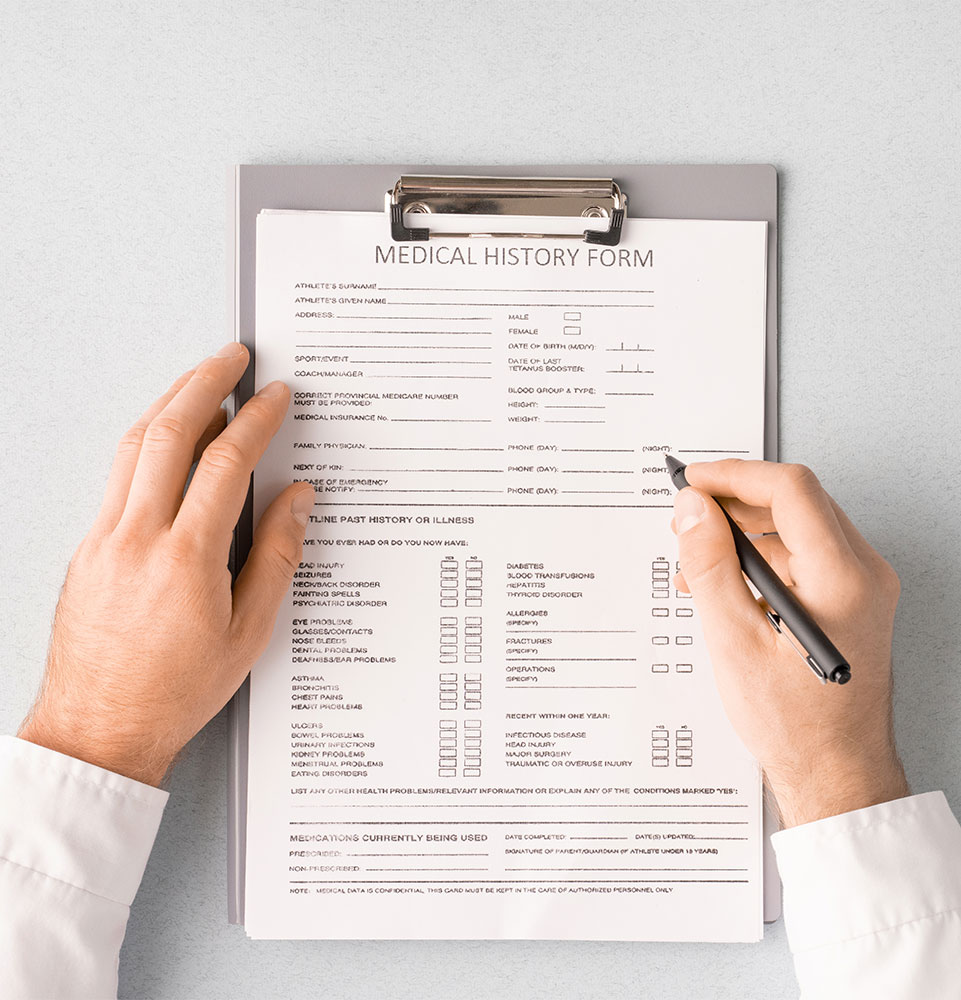 close up of new patient form being filled out