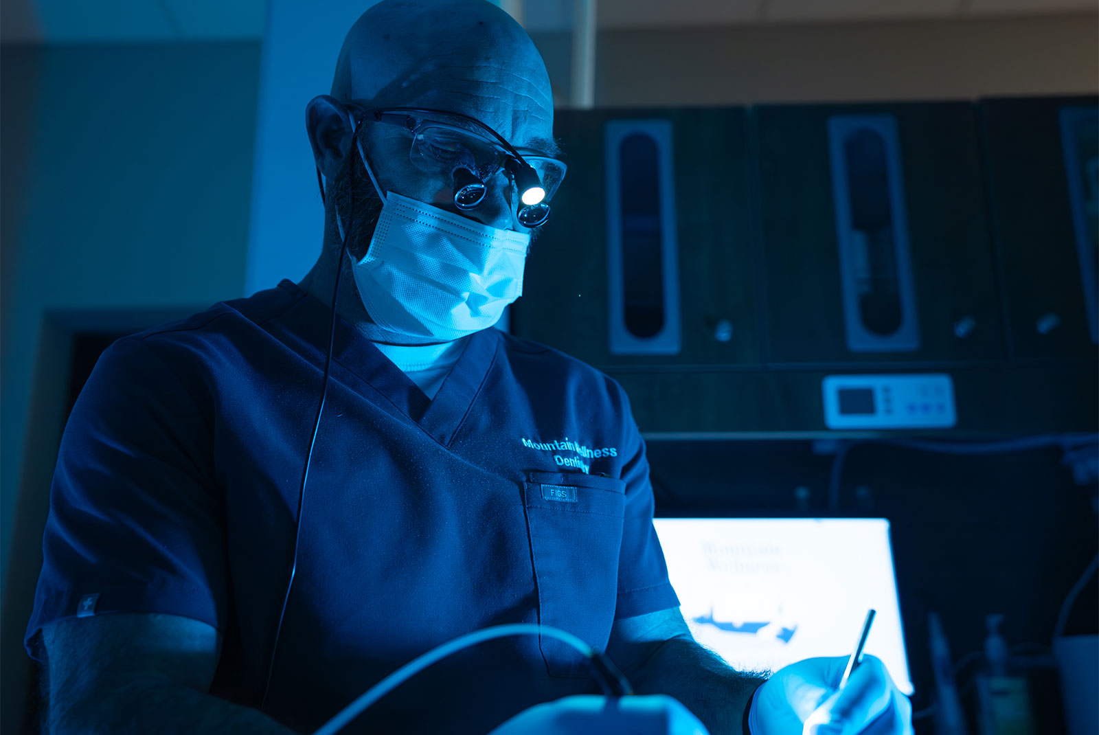 doctor proceeding with dental procedure