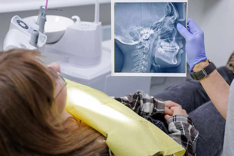 patient looking at x ray of their head to indicate airway analysis treatment